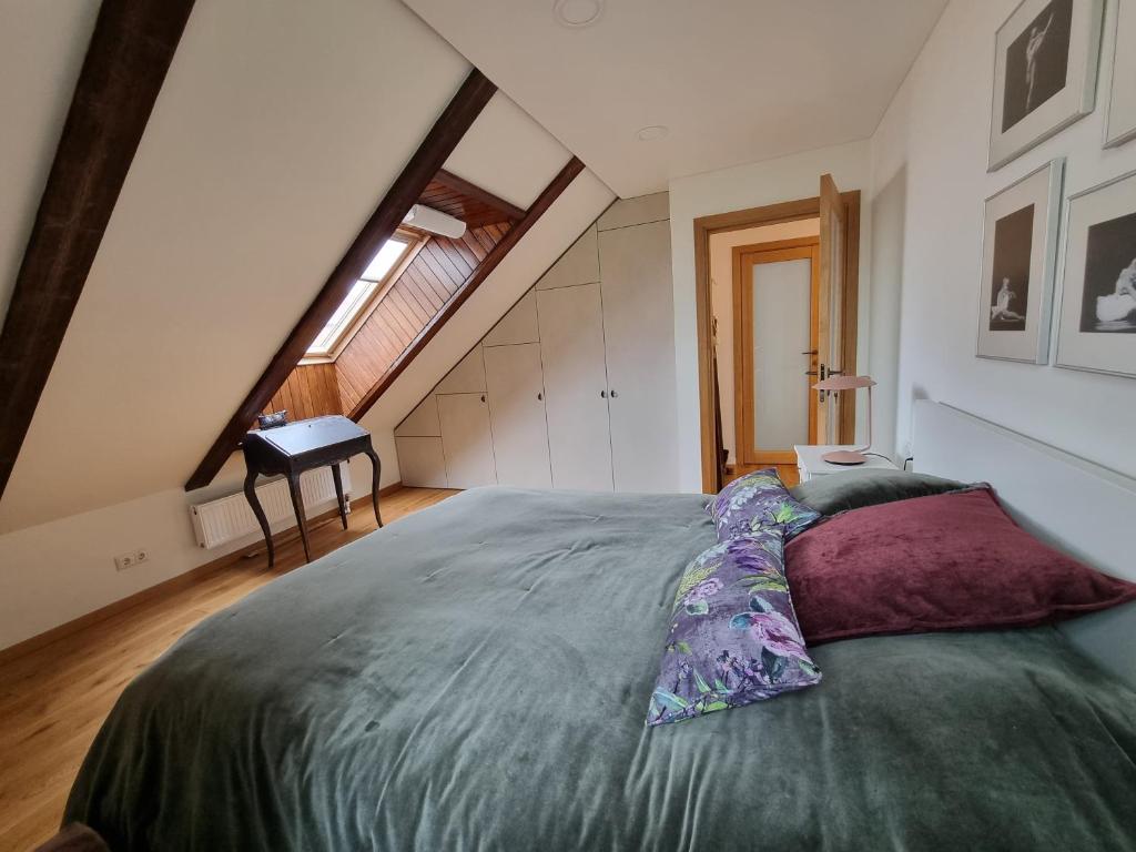 Bedroom corner with built-in wardrobe and skylights