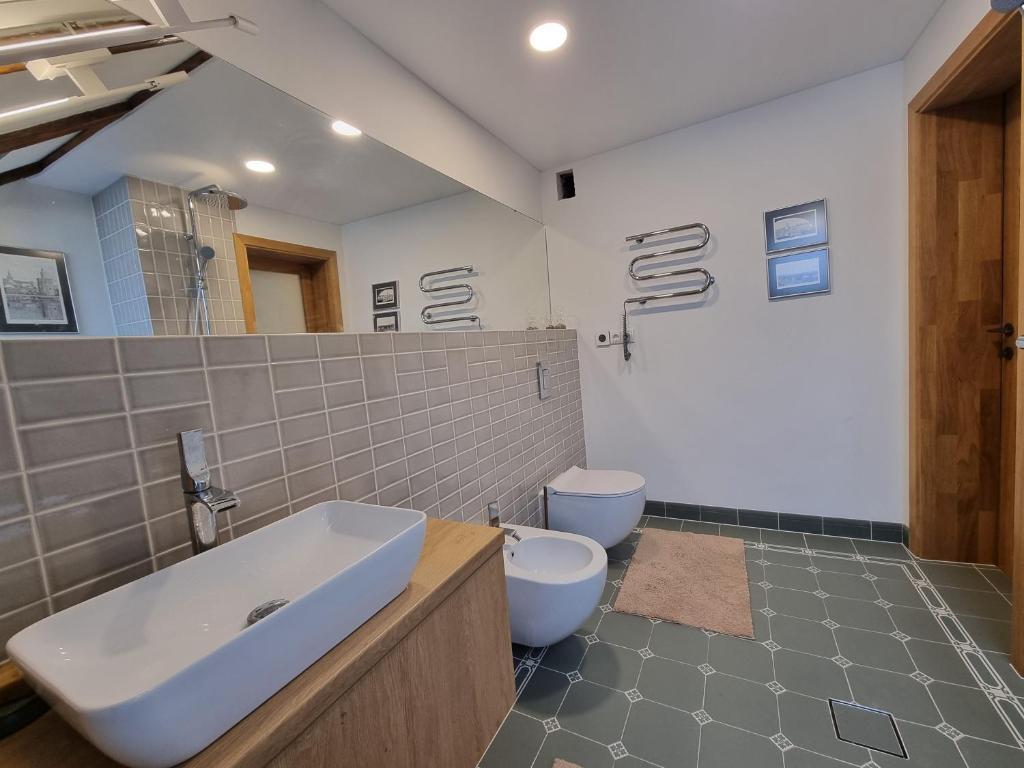 Second bathroom with vessel sink and patterned floor